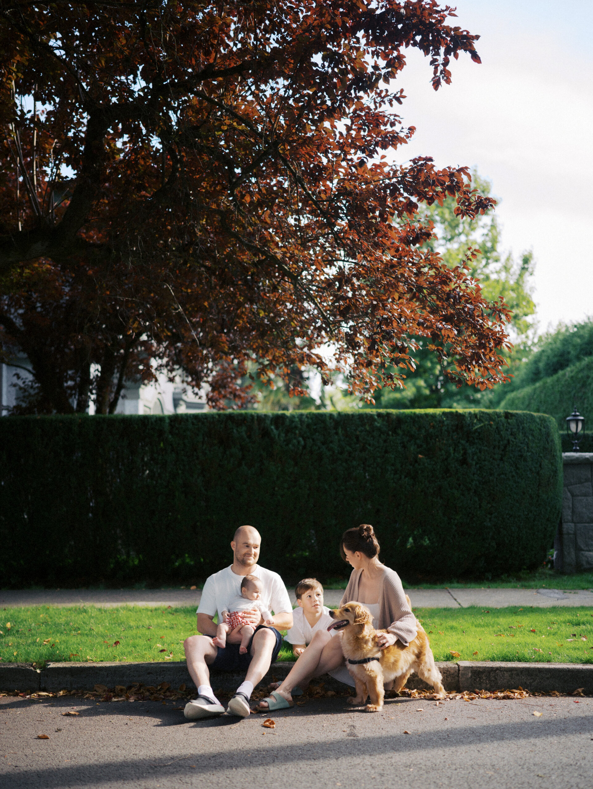 Family of four hanging out together for family photos